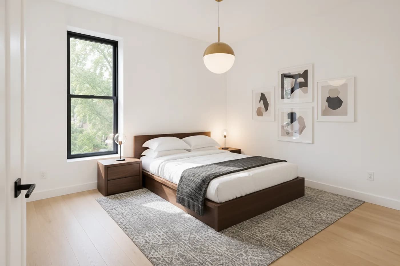 The same bedroom virtually staged with a walnut platform bed, a gray patterned rug, a globe pendant light and four abstract prints
